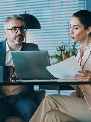 man and woman at a desk
