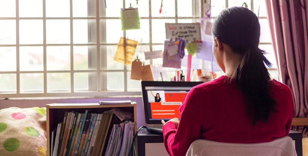 Student doing homework on her laptop. 